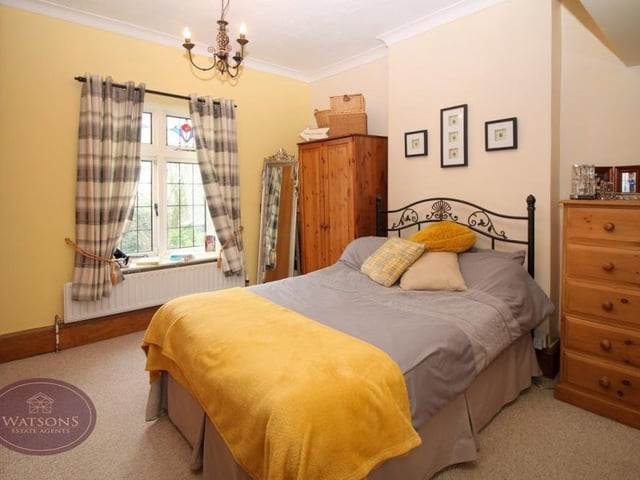 Here is the first of the three bedrooms on the first floor. A pleasant room, it has plenty of space for storage.