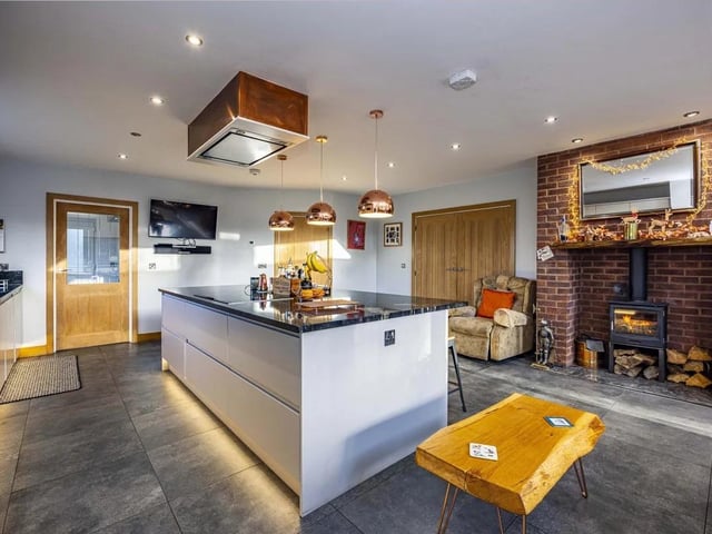 Stunning open-plan kitchen, dining and living area – ideal for modern family living and entertaining, with views over the grounds