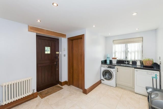 Just off the kitchen is this handy utility room. There is space for a washing machine and tumble dryer.