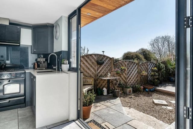 Bi-folding doors in the kitchen lead you to the attractive back garden.