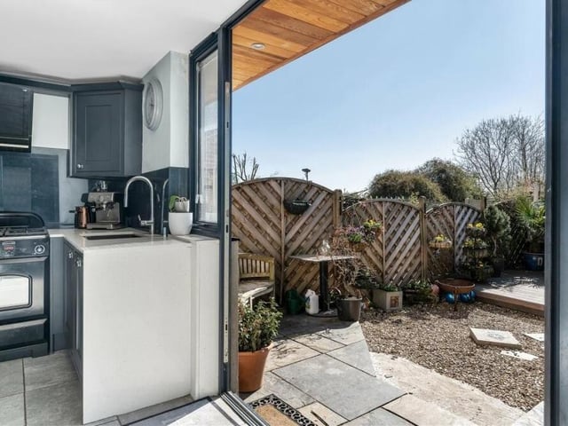 Bi-folding doors in the kitchen lead you to the attractive back garden.