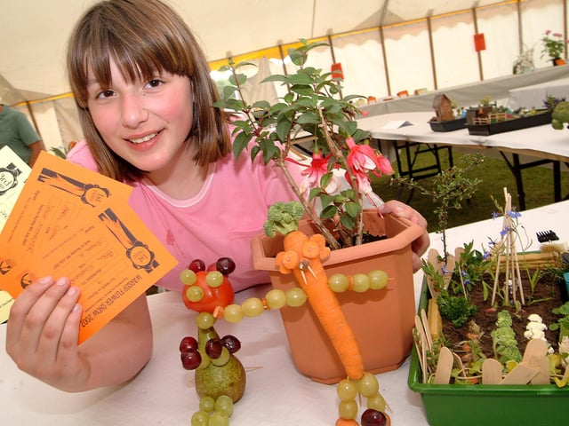 Warsop Carnival. April Cheshire, from Meden Vale, with winning entries in the Space Monster, Dads Allotment and Potted Plant categories of the Children's flower show section. 2007.