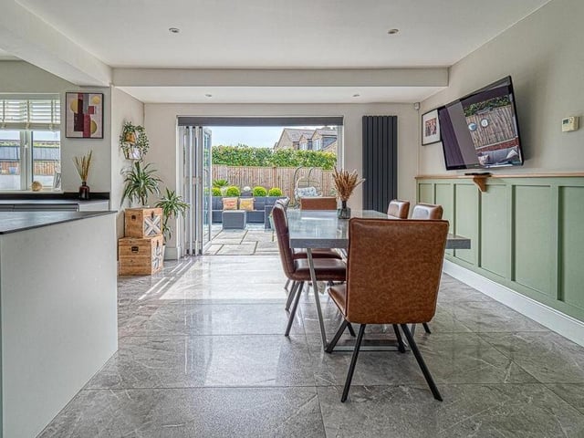 The spacious kitchen and dining area also boasts bi-folding doors that open out to the garden.