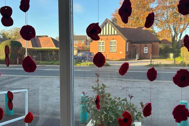 Poppies knitted by the local community.