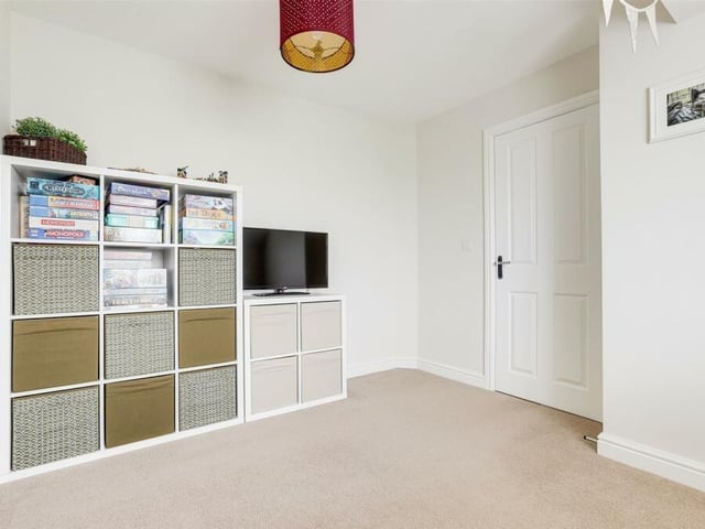 Bedroom number three is a terrific size -- and a versatile space that could used for storage.
