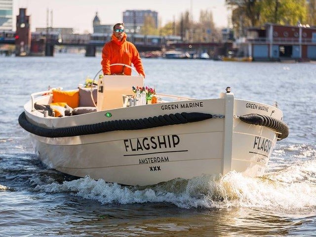 Amsterdam's scenic canals are famous for a reason - enjoy a tour of the city on an open air boat, visiting landmarks like the Anne Frank House, the Jordaan, Rijksmuseum and more. Provided by Flagship Amsterdam.