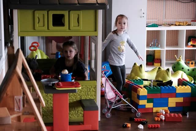 Children of Ukrainian refugees play on board a ferry as they flee the war in Ukraine.