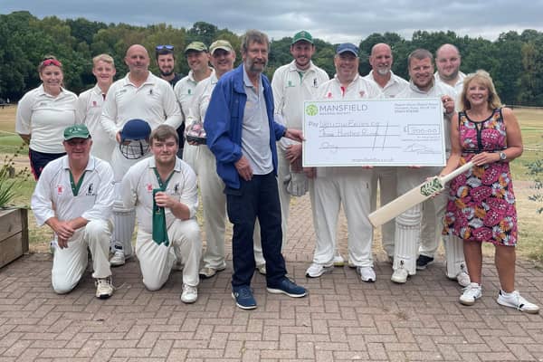 Members of Wellow Exiles Cricket Club receive the £300 donation from Mansfield Building Society.