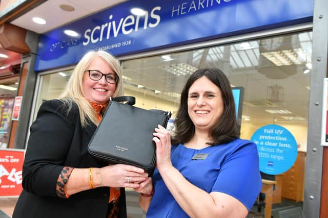 Donna (right) was presented with a designer handbag in recognition of her long service from area manager Helen Bamforth.