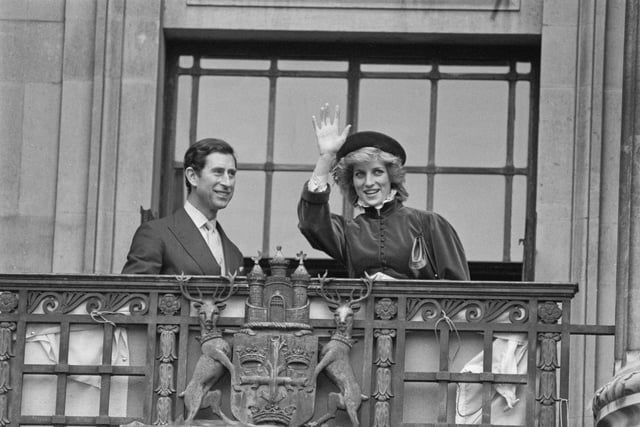 Diana, Princess of Wales (1961-1997), wearing a Caroline Charles outfit with a hat by John Boyd, and Charles, then Prince of Wales waving from the balcony of Nottingham Council House during a visit to Nottingham, England, 7th March 1985. (Photo by Steve Wood/Daily Express/Hulton Archive/Getty Images)