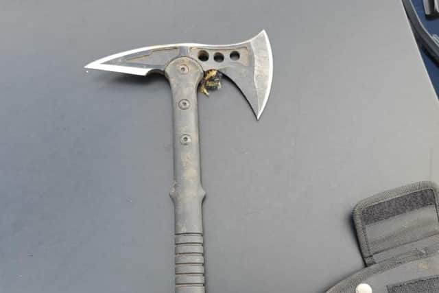 A tomahawk style axe was found in the vehicle