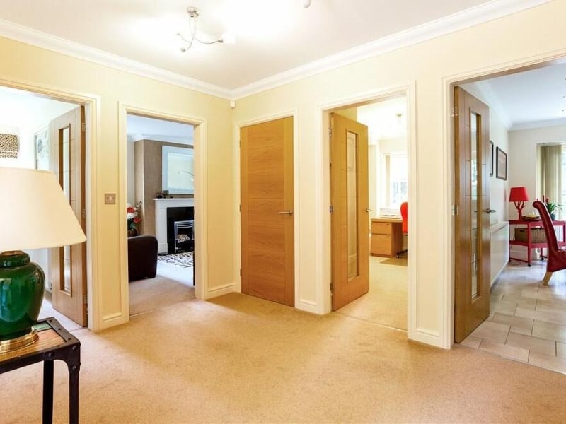 As we prepare to go upstairs, let's pass through the inviting entrance hall, which is spacious and leads to all the main rooms on the ground floor.