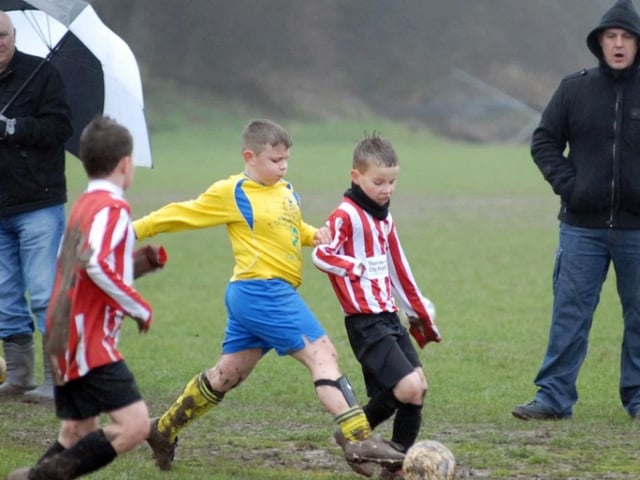 Robin Hood Colts (red and white stripes) v Woodhouse Colts U9s pictured at the Sherwood Fields ground in Edwinstowe in 2011