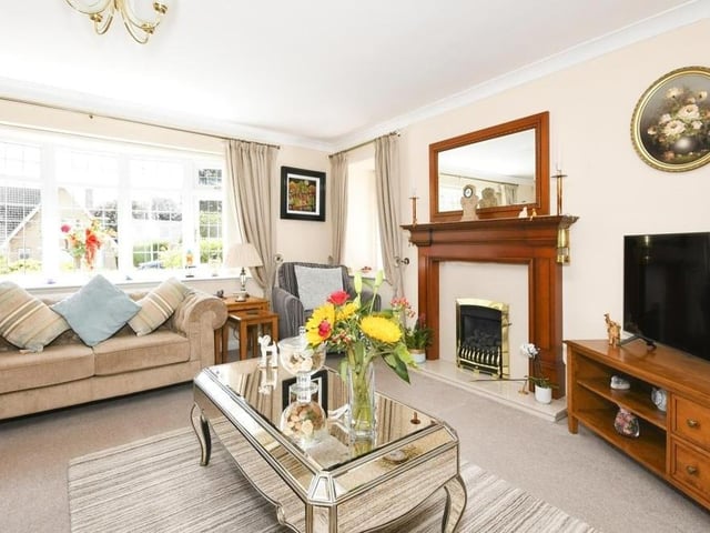 This second image of the lounge shows the feature fireplace and how bright and cosy the room is. Relax at your leisure in here!