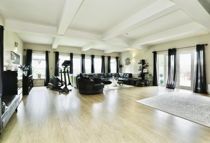 Two outbuildings on the estate have been turned into luxury leisure suites. One has a gym and conservatory, while the other contains a golf and Formula One simulator, with bar. Both could be converted into guest houses or holiday lets, if necessary.