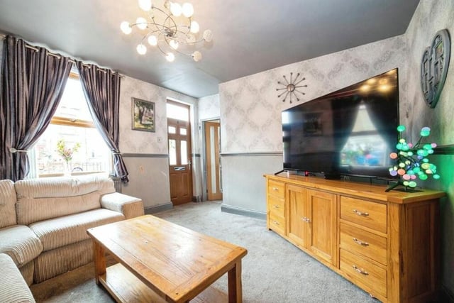 First stop on our tour of the £220,000 Kirkby home is this attractive lounge, which faces the front of the property. Sit back and relax in front of the big-screen TV.