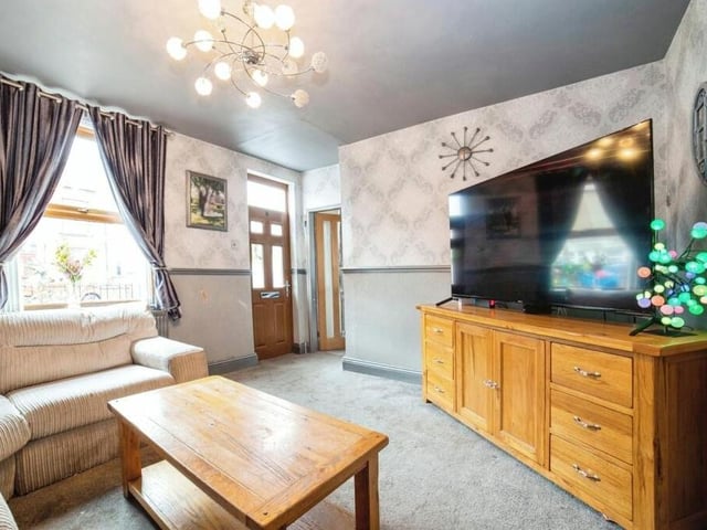 First stop on our tour of the £220,000 Kirkby home is this attractive lounge, which faces the front of the property. Sit back and relax in front of the big-screen TV.