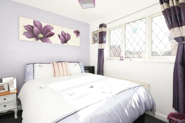 Like all the rooms in the house, this lovely third bedroom is beautifully presented. Again, it faces the back of the property and features built-in storage.