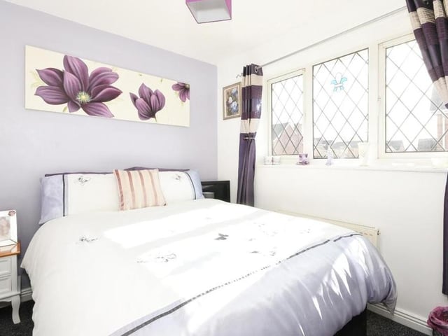 Like all the rooms in the house, this lovely third bedroom is beautifully presented. Again, it faces the back of the property and features built-in storage.