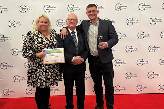 Pictured are Justyna Majer, Councillor Duncan McGregor and Arron Johnson collecting an award