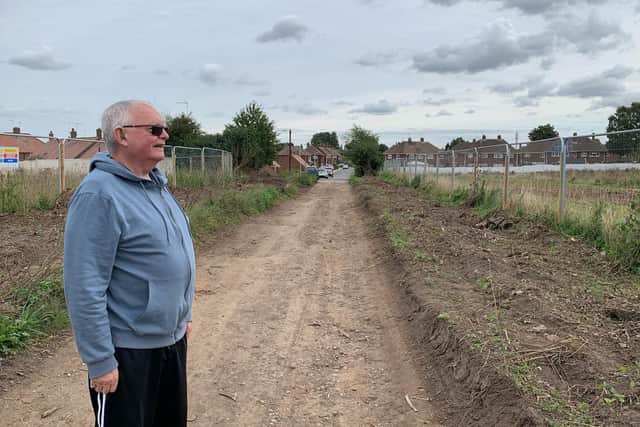 Roy Butler, a resident and parish councillor from Warsop, is 'heartbroken' by the decimated hedgerow.