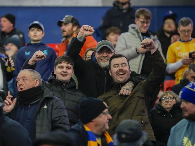 Mansfield Town conceded three times in the final 15 minutes to lose at Bolton Wanderers.