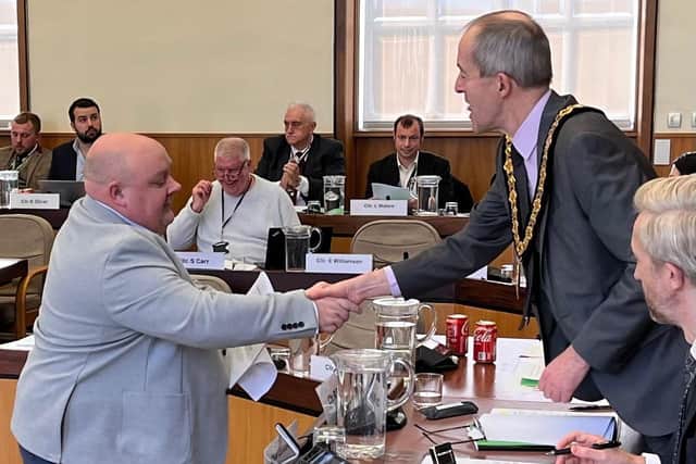 Coun Nigel Moxon hands in the petition to Coun Richard Butler, Nottinghamshire Council chair. Photo: Submitted