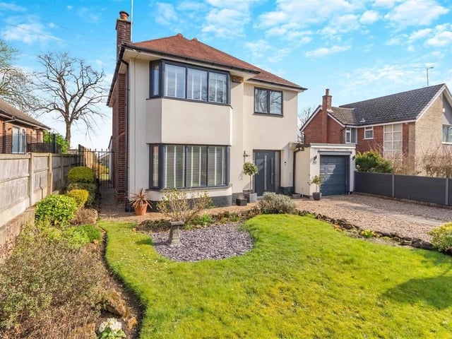 The property stands back from Haddon Road behind a walled and railings boundary frontage with double gates opening on to a gravel driveway which leads to a garage with a remote controlled electric door. The front garden is laid to lawn with plants and shrubs to the borders.