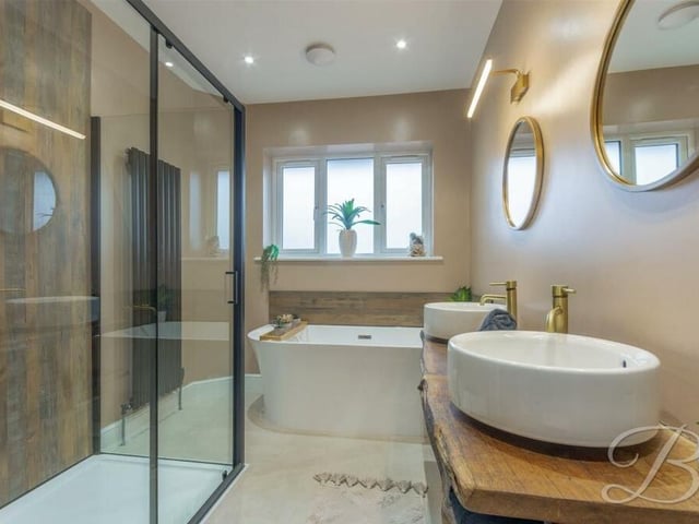 The family bathroom on the first floor is a stunner. It consists of a free-standing bath, separate walk-in shower cubicle, low-flush WC, twin hand wash basin and downlights.