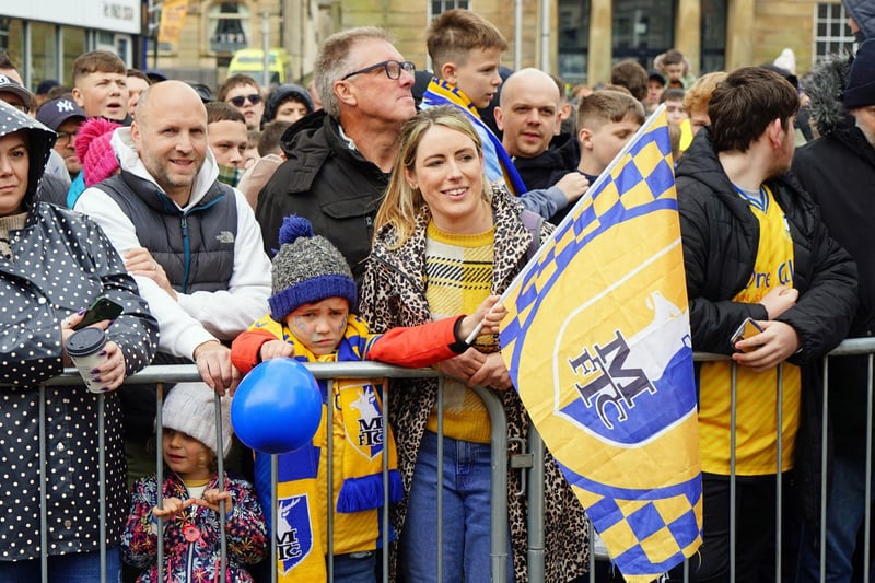 Fans gather for Mansfield Town's open top bus tour through Mansfield.