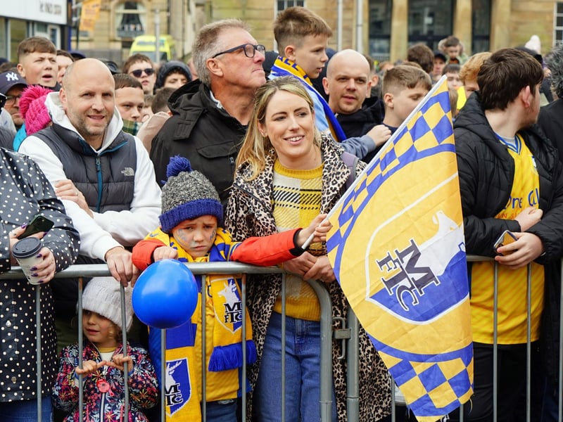 Fans gather for Mansfield Town's open top bus tour through Mansfield.