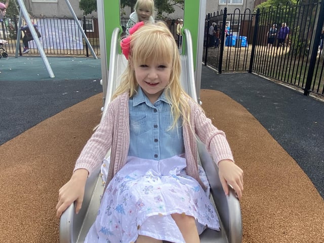 Children try out the new play area
