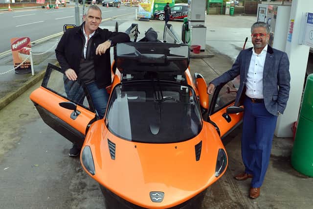 Europe's first flying car in Clipstone Road Service Station Mansfield. Andy Wall Country manager UK PAL-V and Chairman DSK Nottingham ltd Sivapalan Krishanand.