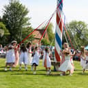 The event is centred around the village's spectacular 17 metres high painted maypole.