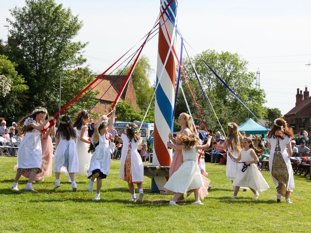 The event is centred around the village's spectacular 17 metres high painted maypole.