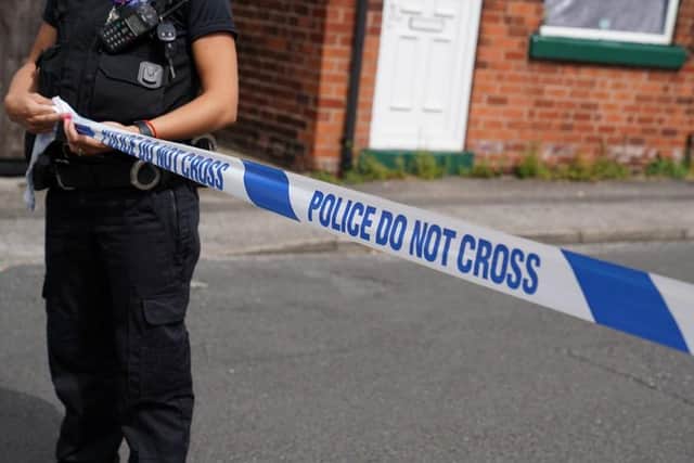 Police cordon a house off.