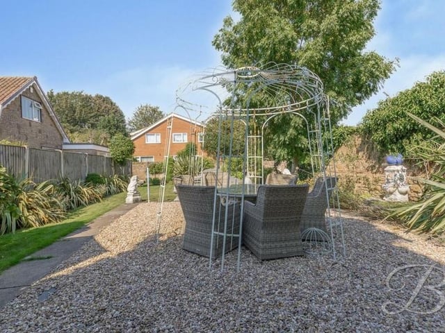 At the bottom end of the back garden is this pleasant, gravelled patio, with space for a seating area to entertain friends.