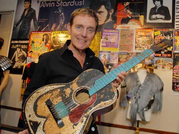 Late rocker Alvin Stardust with the guitar he used to play with Buddy Holly in Doncaster in 1958 and which was signed by the star. 