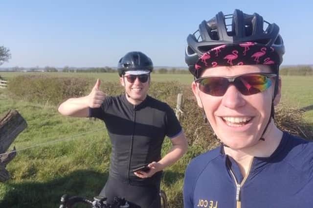 Andrew Goddard (left) and Will Phipps give the thumbs up to their sponsored cycling marathon in aid of The Brain Tumour Charity.