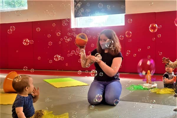 Louise Howard hosting one of her Debutots sessions for babies, which involve storytelling and bubbles.