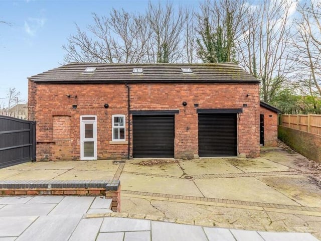 The detached, two-storey outbuilding is a substantial asset to the property. On the ground floor are an office and two large garages with electric roller-doors, and on the first floor is a large storage area with three Velux roof windows.