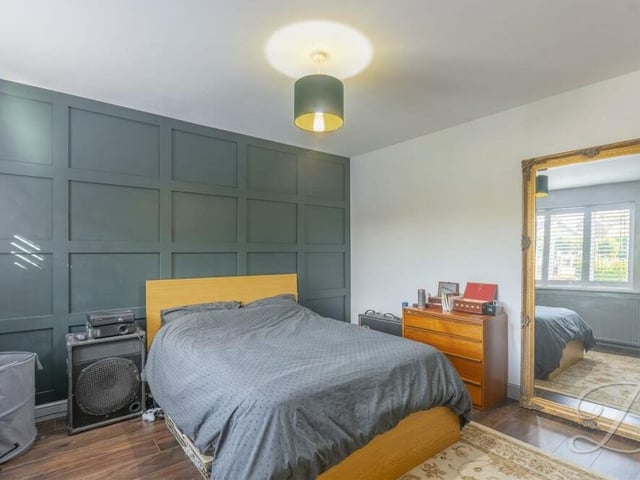 A second look at the second bedroom, which is a stylish retreat. The floor is laminated and the window faces the front of the Sutton property.