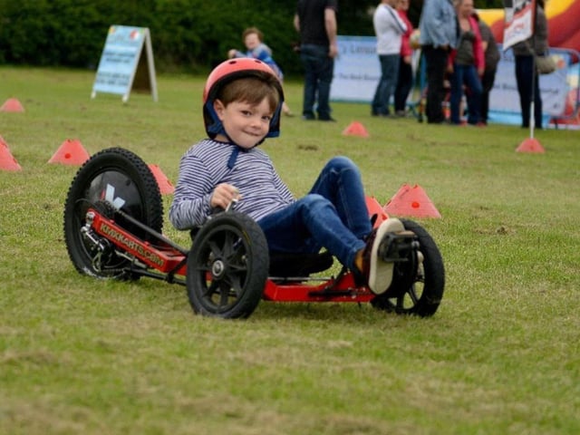Hugo Howells tries out a racing pedal kart at the 2019 Greasley Gathering.