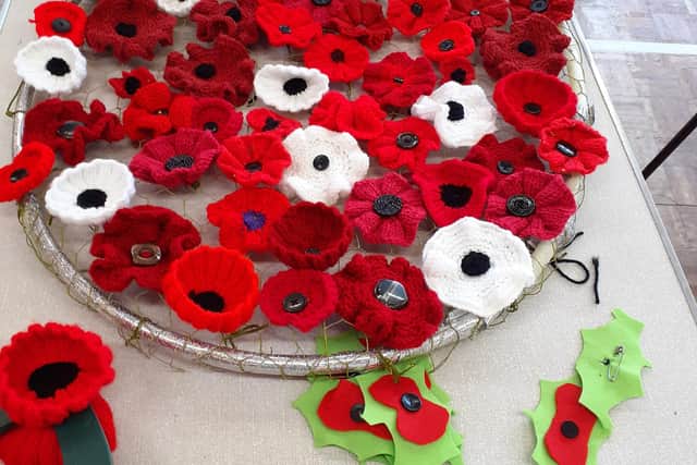 A plate of knitted and crocheted poppies. Photo: Submitted