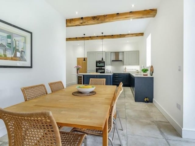 The kitchen at The Granary extends to this pleasant dining area, which is ideal for family meals or for entertaining guests over dinner.