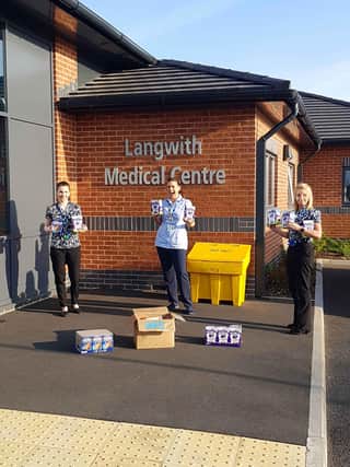 Staff at Langwith Medical Centre recieve donations from the team at Stepnell.