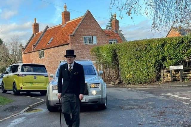 Andrew Brown working as a funeral director.