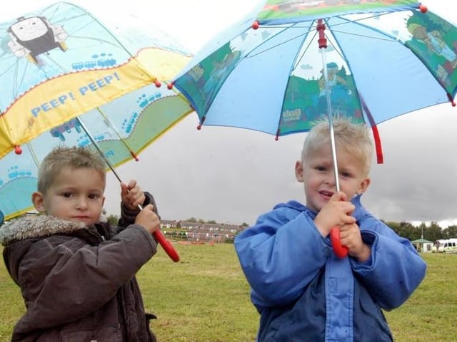 Youngsters Daniel Buckley and Cory Buckley from Langwith brave the rain to go to Shirebrook festival.
