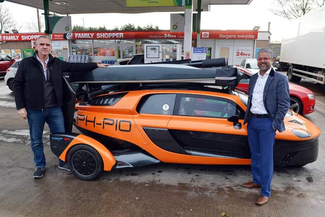 Europe's first flying car at Clipstone Road Service Station Mansfield. Andy Wall Country manager UK PAL-V and Chairman DSK Nottingham Ltd Sivapalan Krishanand.
