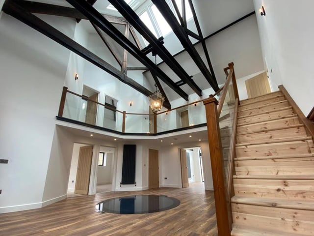 As soon as you walk through the door, you get a sense of openness and light. The central atrium, complete with its characterful staircase, is an impressive way to introduce the property.